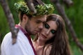 Guy hugs young beautiful girl at folk festival Royalty Free Stock Photo