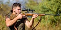 Guy hunting nature environment. Hunting weapon gun or rifle. Hunting target. Looking at target through sniper scope. Man Royalty Free Stock Photo