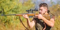 Guy hunting nature environment. Hunting weapon gun or rifle. Hunting target. Looking at target through sniper scope. Man Royalty Free Stock Photo