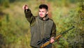 Guy hunting nature environment. Man bearded hunter rifle nature background. Hunting hobby concept. Hunting season