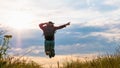 Guy in a jump,pointing with the forefinger,a man in nature,a happy man enjoying life.Spending time in the field Royalty Free Stock Photo