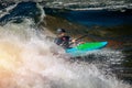 Guy in kayak sails mountain river. Whitewater kayaking, extreme sport rafting Royalty Free Stock Photo