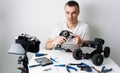 The guy keeps a video blog about radio controlled car models. On the table are tools for repair. Royalty Free Stock Photo