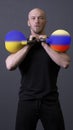 The guy with the kettlebells is standing russia ukraine ukrainian national, for government battle for concept and