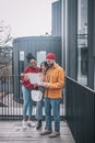 Guy with laptop and two girls with coffee