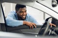 Guy Looking At Auto Interior Choosing New Automobile In Dealership