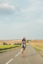 Guy in love circling a girl on the road. Lifestyle, romance, love, travel. Copy space Royalty Free Stock Photo