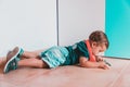 Guy lying on the bedroom floor listening to cell phone music Royalty Free Stock Photo