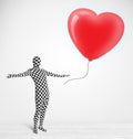 Guy in morpsuit body suit looking at a red balloon shaped heart