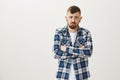 Guy never will speak with rude people again. Portrait of miserable offended mature male coworker in plaid shirt, holding