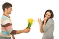 Guy offering flowers to picky woman