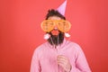 Guy in party hat celebrate, posing with photo props. Hipster in giant sunglasses celebrating. Emotional diversity Royalty Free Stock Photo
