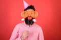 Guy in party hat celebrate, posing with photo props. Hipster in giant sunglasses celebrating. Emotional diversity Royalty Free Stock Photo