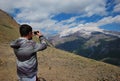 The guy photographs Elbrus Royalty Free Stock Photo