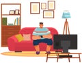 Guy playing video games sitting on couch with gamepad. Man relaxing at home alone at televisor