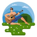The guy plays the guitar in the hiking on the flowering meadow
