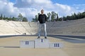 The guy on the podium of the Olympic stadium Panathinaikos, Athens, Greece.