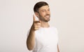 Guy pointing finger at camera standing on white background Royalty Free Stock Photo