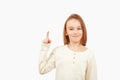 Guy pointing up at empty space. Boy gesturing new idea. Emotional portrait of happy teen boy over white background with copy space Royalty Free Stock Photo