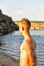 Guy portrait on the background of river beach Royalty Free Stock Photo