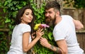 Guy prepared surprise flowers for girlfriend. Bring her favorite flowers. Man gives flower bouquet girl romantic date