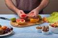 Guy is preparing a fruit salad in the kitchen Royalty Free Stock Photo