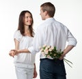 Guy presenting flowers to girfriend Royalty Free Stock Photo