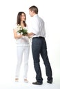Guy presenting flowers to young lady Royalty Free Stock Photo