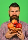 Guy presents homegrown harvest. Farmer with seductive face