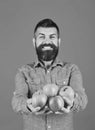 Guy presents homegrown harvest. Farmer with smiling face