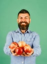 Guy presents homegrown harvest. Farmer with smiling face