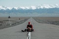 Guy sitting on ground and looking far away Royalty Free Stock Photo