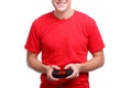 Guy with a smile playing on the joystick on a white isolated background