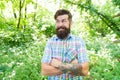 Guy relax in summer nature. Man handsome beard and mustache in summer forest. Summer vacation concept. United with Royalty Free Stock Photo