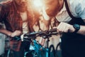 Guy and Repairman Fixes Bicycle in Sport Store