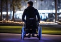 A guy in a RGB led ligth wheel chair with aileron