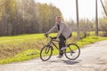 A guy riding a bike on rural roads Royalty Free Stock Photo