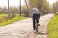 A guy riding a bike on rural roads Royalty Free Stock Photo