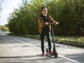 The guy riding on the kickscooter Royalty Free Stock Photo