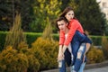 Guy rolls his girlfriend Piggyback Royalty Free Stock Photo