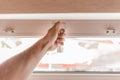 The guy`s hand opens a plastic double window for the handle pvc double glazing Royalty Free Stock Photo