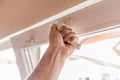 The guy`s hand opens a plastic double window for the handle pvc double glazing Royalty Free Stock Photo