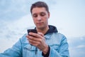 A guy on a scooter with a phone Royalty Free Stock Photo