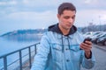 A guy on a scooter with a phone Royalty Free Stock Photo