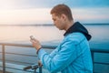 A guy on a scooter with a phone Royalty Free Stock Photo