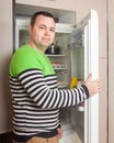 Guy searching for something in refrigerator Royalty Free Stock Photo