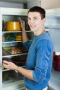 Guy searching for something in refrigerator Royalty Free Stock Photo