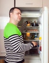 Guy searching for something in refrigerator Royalty Free Stock Photo