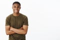 Guy seems to have skills. Portrait of confident charismatic young handsome african-american male in t-shirt holding