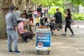 Seller of hot caramelised peanuts almonds. London, Britain, May 29, 2021 Royalty Free Stock Photo